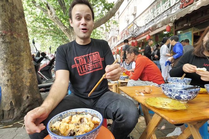 3-Hour Private Night Tour: Beijing Foodie Experience - Xinjiang Taste Restaurant: lamb kabobs, sides, and the Erguotou try