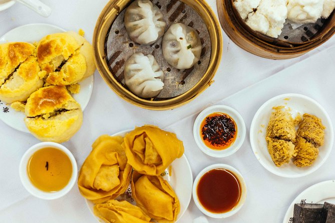 A Taste of Hong Kong: Private Tour With Locals - Ladies Market: Fishballs, Shaomai, and How Locals Snack Fast