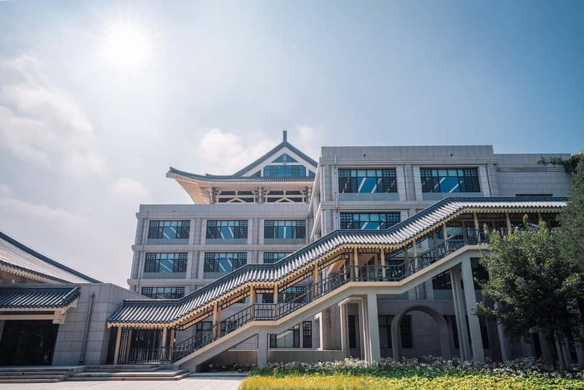 Beijing: Peking University Campus Guided Walking Tour - Reading PKU gardens, courtyards, and building layouts