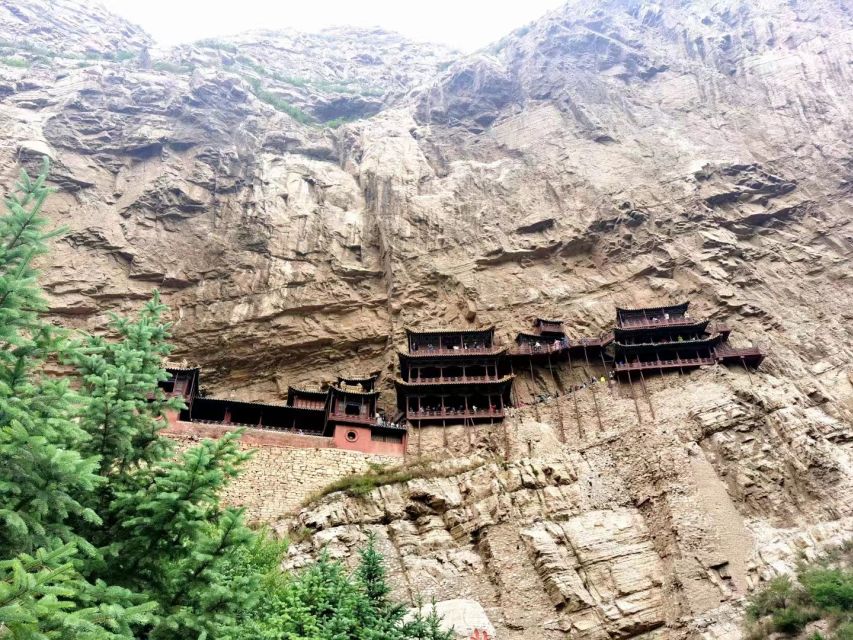 Datong: Temples and Grottoes day tour with tickets options - Yungang Grottoes UNESCO caves: the numbers that hit you in person