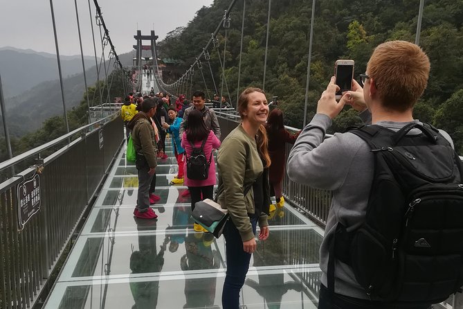 Gulong Gorge Skywalk Glass Bridge and Waterfall View Private Tour - Jinlong Cave of Qingyuan: Underground River Walk and Wet-Weather Reality