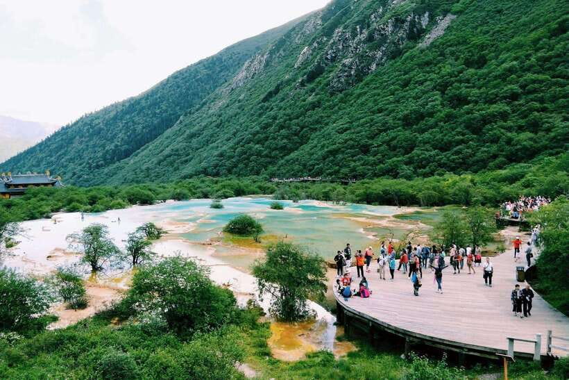 Huanglong Scenic Area: Explore Stunning Five-Colored Ponds - Xuebaoding and Sleeping Beauty Mountain: peak views with meaning