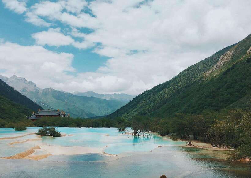 Huanglong Scenic Area: Explore Stunning Five-Colored Ponds - Primeval forest, canyons, and the altitude reality check