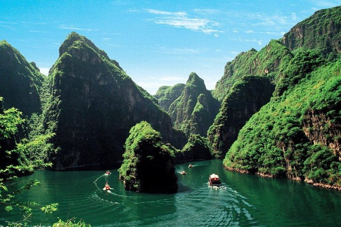 Private Longqing Gorge & Guyaju Cave Day Tour w/ Cruise Ride - Entering Guyaju: cliff homes, doors, windows, kitchen ranges