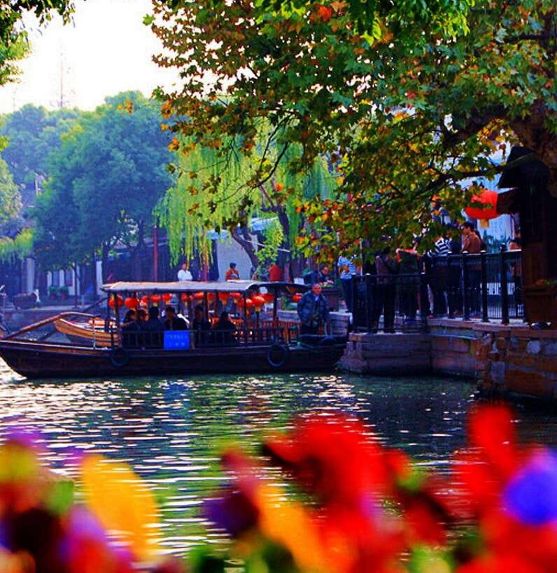Private Tour:Zhujiajiao Water Town by German-Speaking Guide - Stone-paved water markets, crafts, and choosing good street snacks
