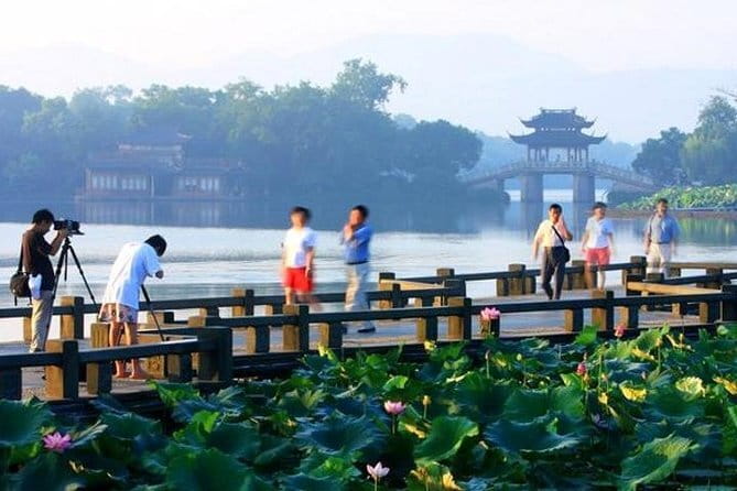 Wuzhen Water Town Self-Guided Tour with Private Transfer from Hangzhou - Xi Zha: ferry ride, stone alleys, bridges, and water markets