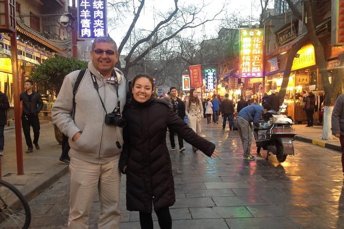 Xi'an Gourmet Walking Tour at Night - Muslim Quarter lanes, candy making, sweet drinks, and grilled bites
